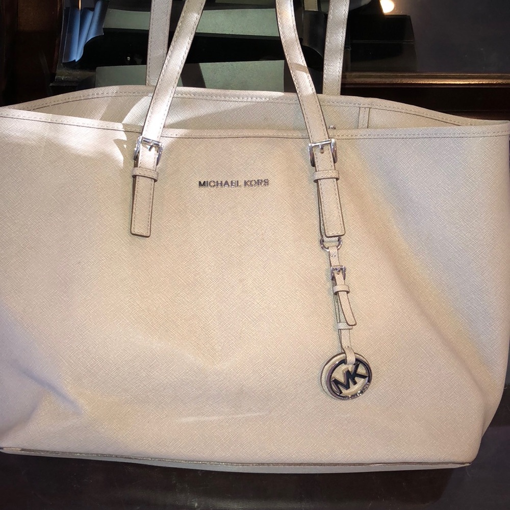 A huge, grey, MK tote bag